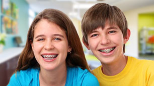 A brother and sister smiling